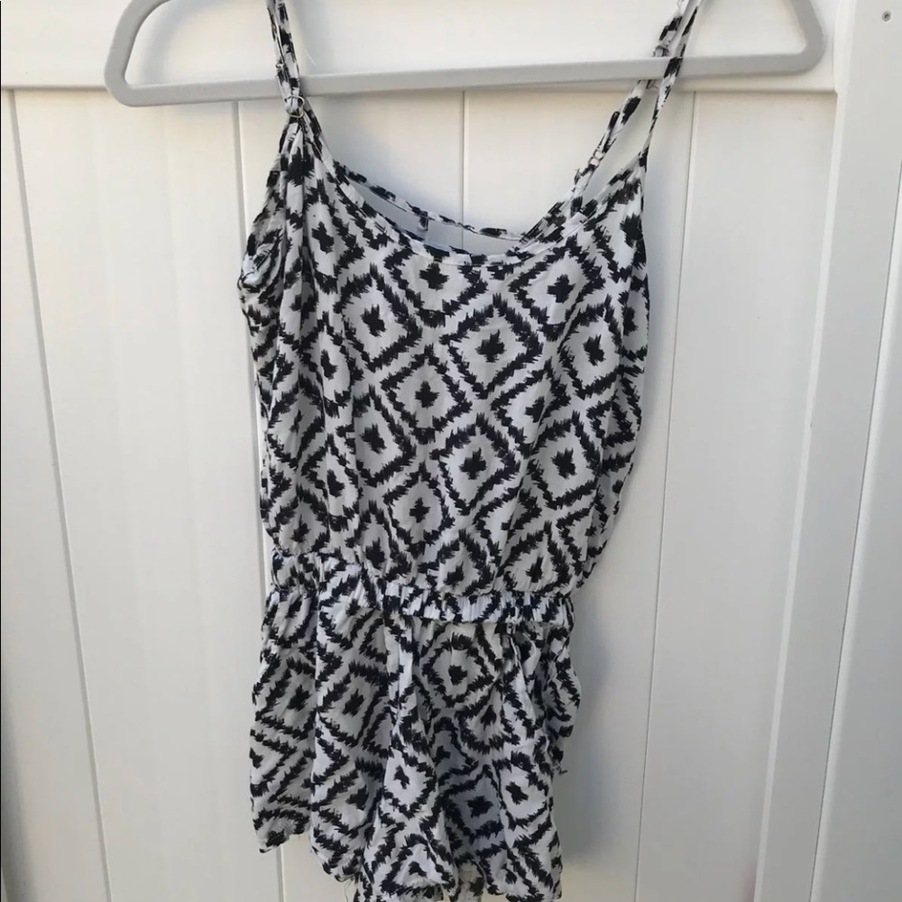 A black and white zig zag romper